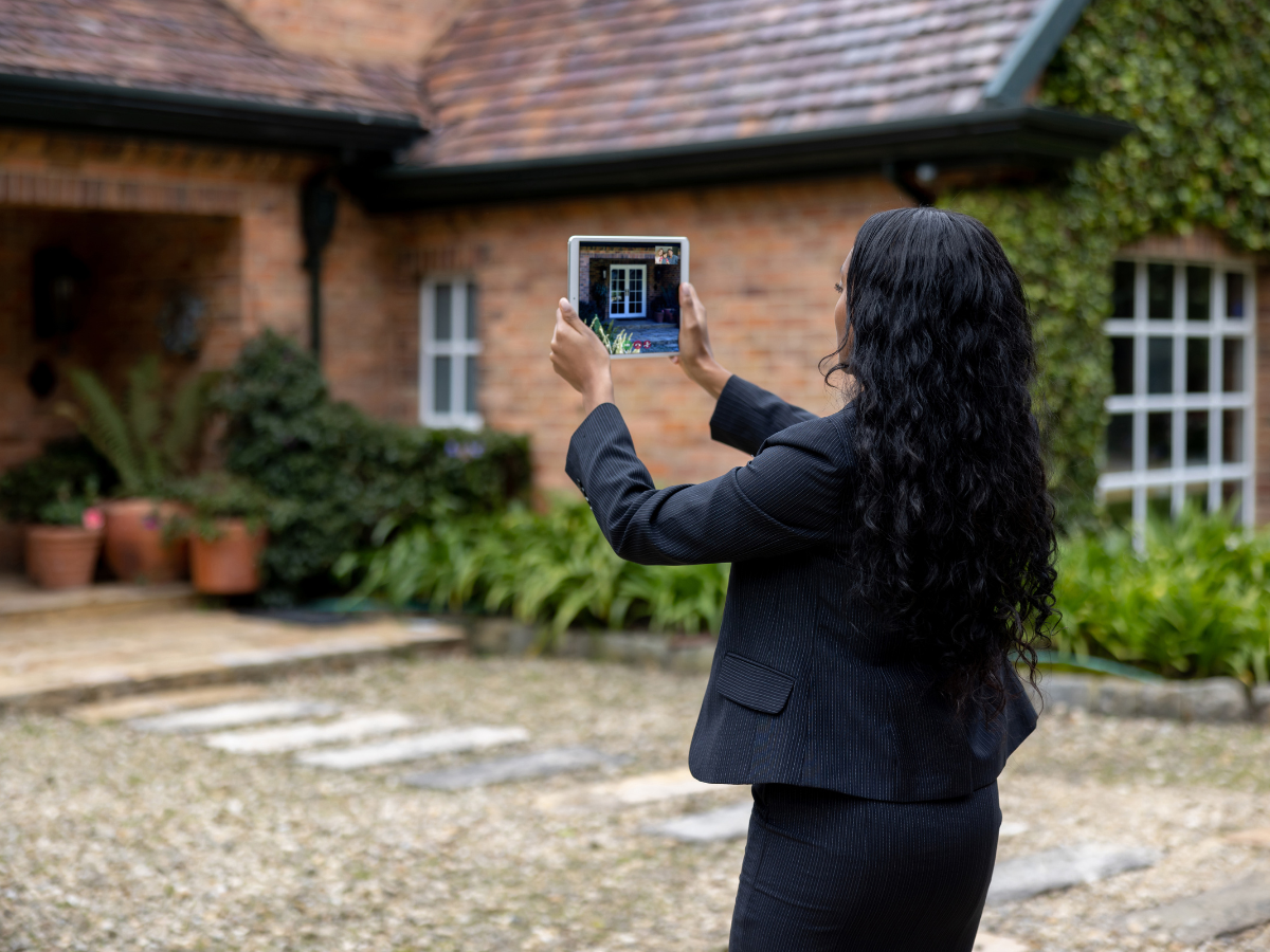 Female real estate agent making a online tour of a home via video chat