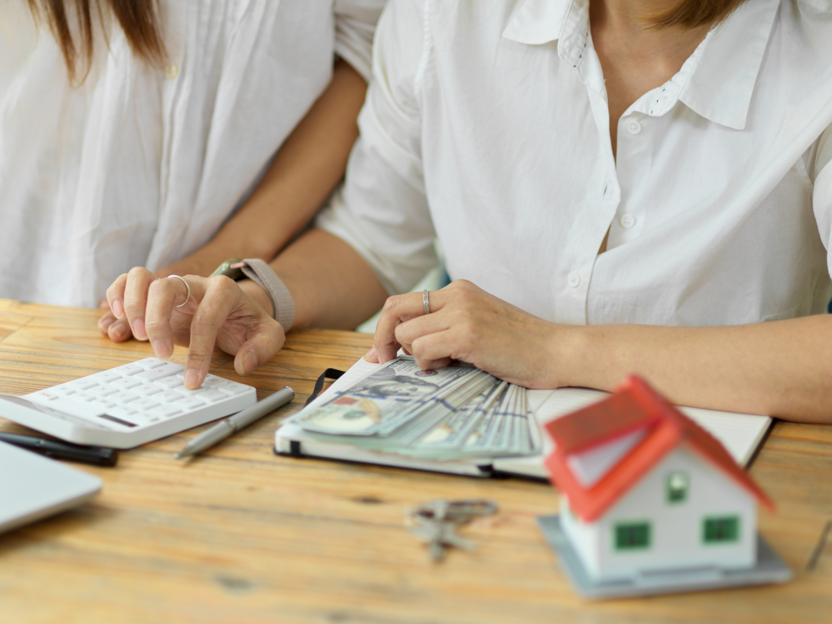 A real estate agent calculates the buyer's down payment