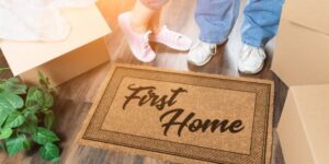Man and Woman Unpacking near First Home Welcome Mat in Cleveland Ohio