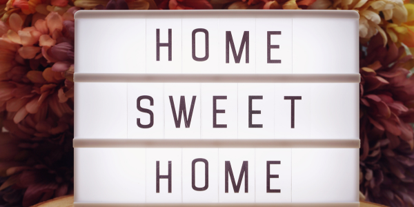 Home Sweet Home text in light box on spring flowers of Northeast Ohio